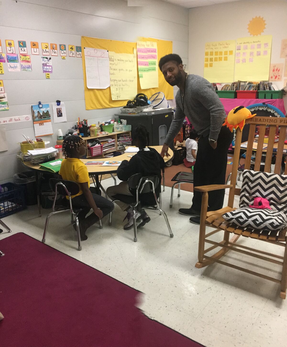 Willie Turral working directly with students in an elementary classroom